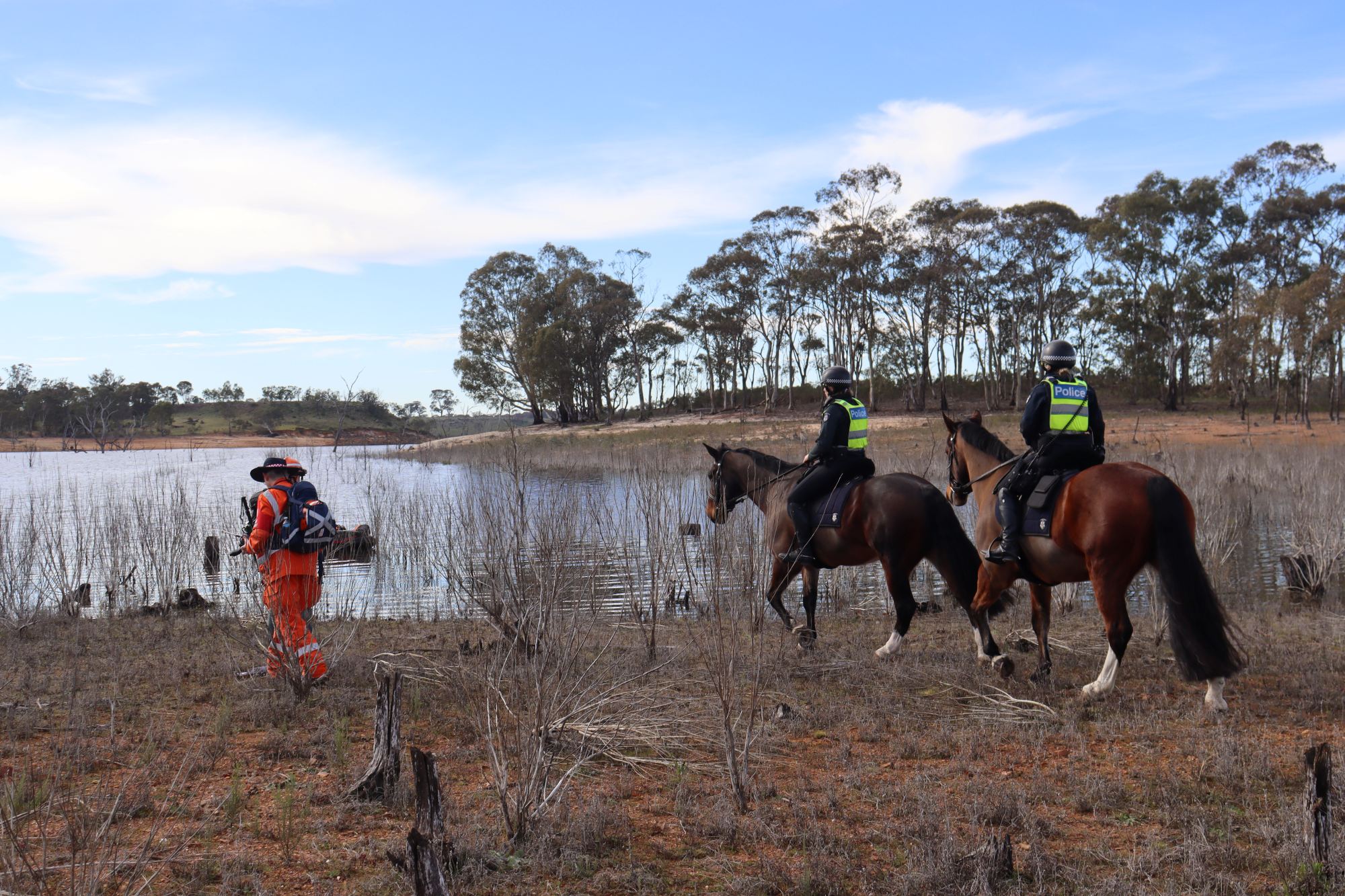 VICSES volunteers and Victoria Police search the shoreline of Lake Eppalock during a multi-agency search and rescue exercise